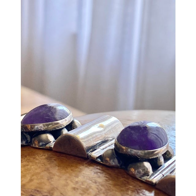 Large, amethyst cabochons in rich sterling silver. A bold statement piece of jewelry that always turns heads. .5 depth