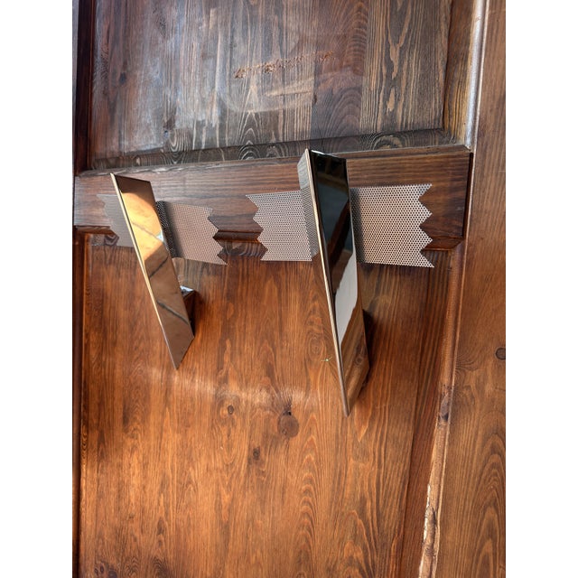 Original signed vintage wall lamps designed by J. T. Kalmar. Chrome finish. The slim and minimalist form perfectly...