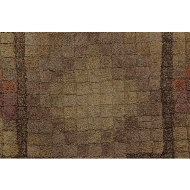 This antique 2x4 American hooked rug, circa 1920–1929, features a geometric medallion visual juxtaposition rendered in...