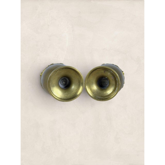 Antique English Brass Pair of Urns Hand-worked repoussé florals give these Victorian brass urns a depth and texture that...