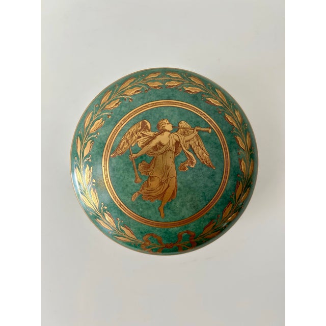 Set of three, Mottahedeh porcelain, lidded, nesting trinket boxes. Marbled green finish with gold leaf border surround the...