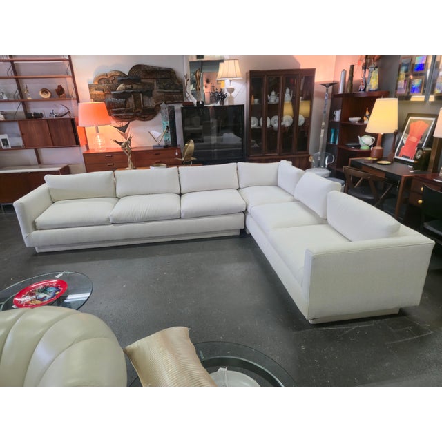 This fantastic 2 Piece sectional is off white in color with a light tan wove thru upholstery giving a slight look of...