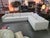 This fantastic 2 Piece sectional is off white in color with a light tan wove thru upholstery giving a slight look of...
