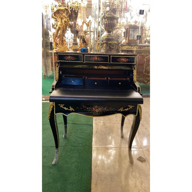A breathtaking example of French craftsmanship, this Louis XV Secretary Desk is handcrafted from solid mahogany and...