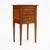 Side table from France in the Directoire style. This piece is made of solid wood construction, primarily cherry wood. It...