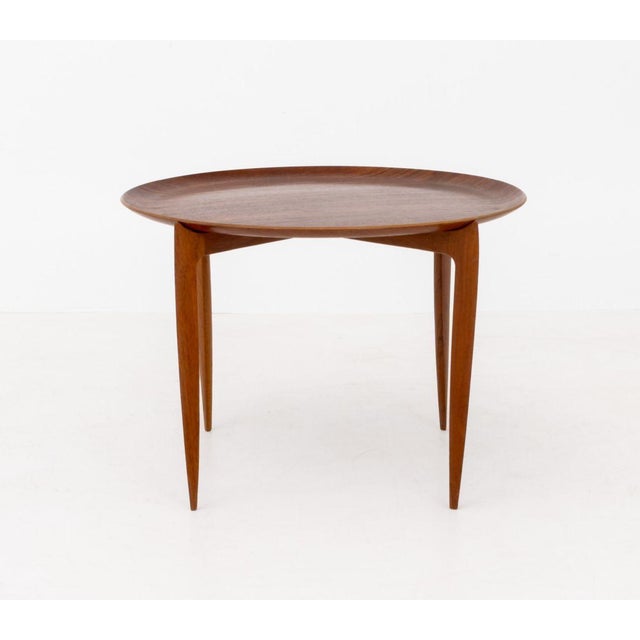 Fritz Hansen Teak Folding Tray Table, with removable circular top on folding stand with four tapered legs, marked "FH Made...