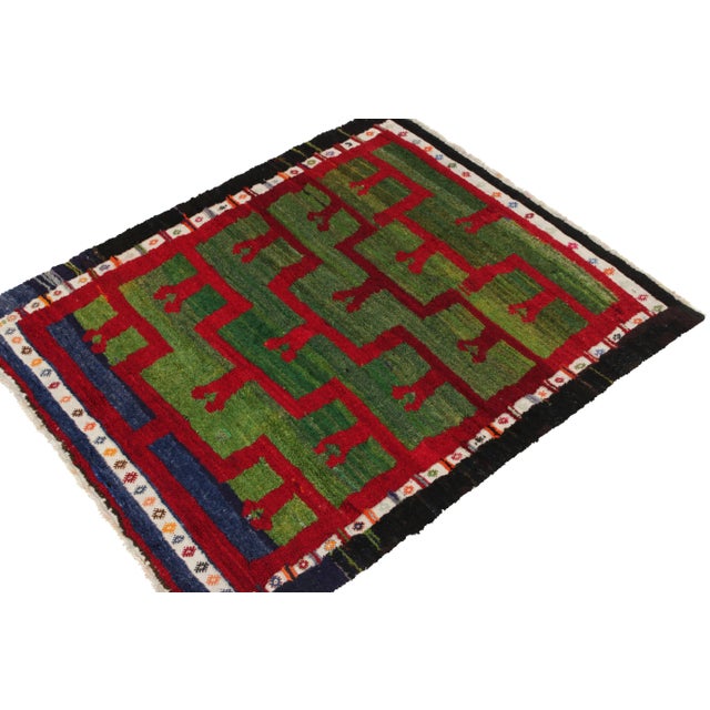 Hand-knotted in wool from Turkey circa 1950-1960, a vintage 5x6 Tulu rug from our Antique & Vintage collection celebrating...