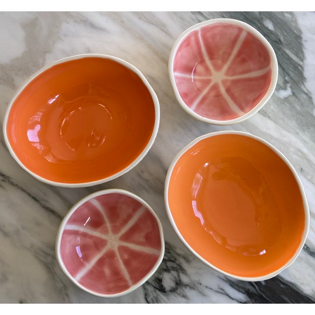 Painted and glazed in life-like color with stippled texture on the undersides, we present a set of four vintage majolica...