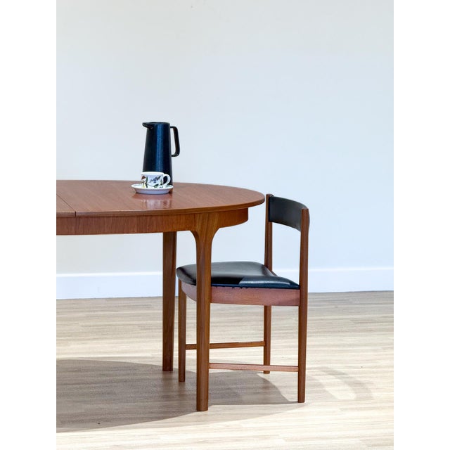 A mcintosh extending dining set by tom robertson — dunvegan collection, 1960s a distinguished dining set designed by tom...