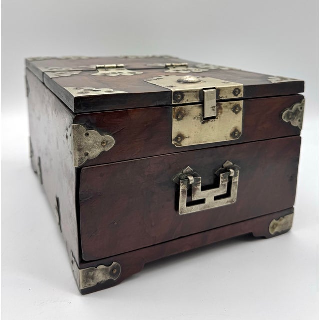 Antique Chinese Hardwood Vanity Box A beautifully crafted antique Chinese hardwood vanity box featuring a lift-top mirror,...