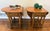 A handsome matched pair of vintage Riverside Furniture drop-leaf end tables featuring warm oak construction, beautifully...