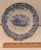 Ceramic plate with no maker's mark on reverse. The Crystal Palace is pictured in blue with a blue floral border. Blaze...
