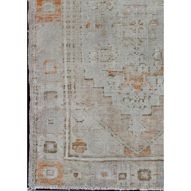 Vintage Turkish Oushak carpet with beautiful floral motifs in tan, camel and orange, Keivan Woven Arts / rug country of...