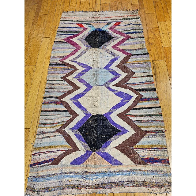 This extraordinary vintage Moroccan kilim carries a story within its very fabric — it was woven as the foundation piece...