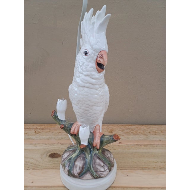 Beautiful regal porcelain perched cockatoo lamp. This lamp will be a statement piece in any room!