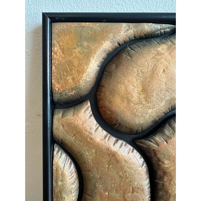 Petite abstract copper wall sculpture presented in a black frame. Features a sculptural copper composition with natural...