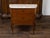A French walnut commode from the 19th century, with variegated marble top and two drawers. Created in France during the...