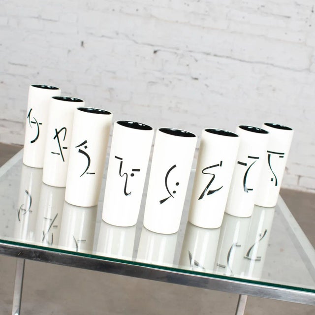 Gorgeous set of 8 vintage ceramic tumblers or vases with Asian symbols in black and white. In amazing vintage condition....