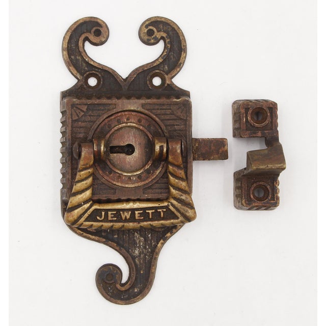 Antique ice box latch with a catch that is left swing. Made by Jewett. No key is included. The original mounting screws...