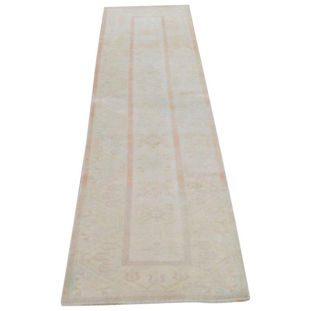 Hand-knotted with care using traditional rug-making techniques, this wool rug blends timeless craftsmanship with a modern...