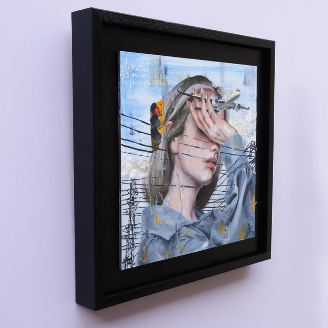 Mixed Signals presents a close-up of a figure partially obscured by a hand, evoking a sense of introspection and...