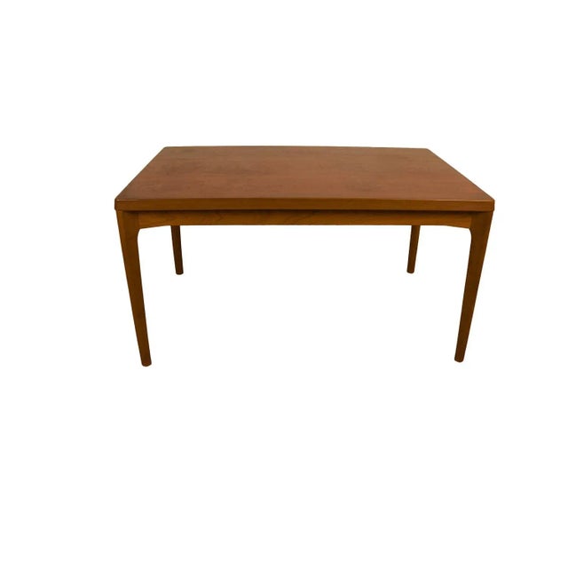 An exceptional Danish Modern teak extension dining table designed by Henning Kjaernulf for Vejle Stole og Møbelfabrik....