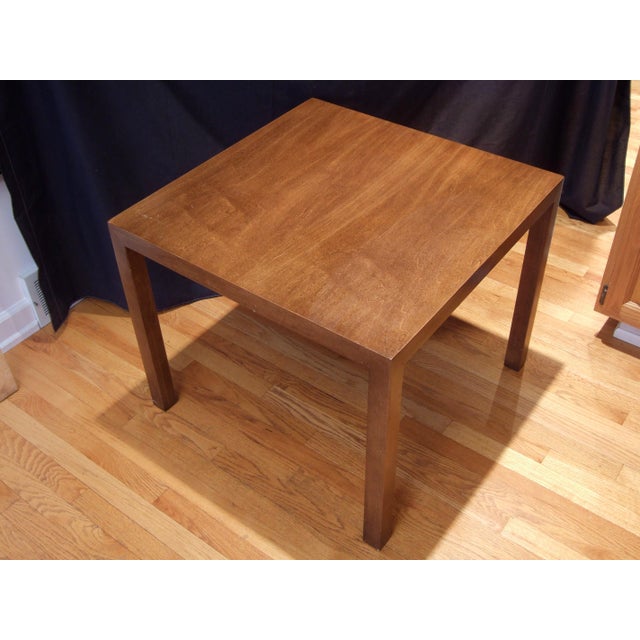 Offering a Mid-Century Modern side table by Founders Furniture. The piece features a classic Parsons design, with square...