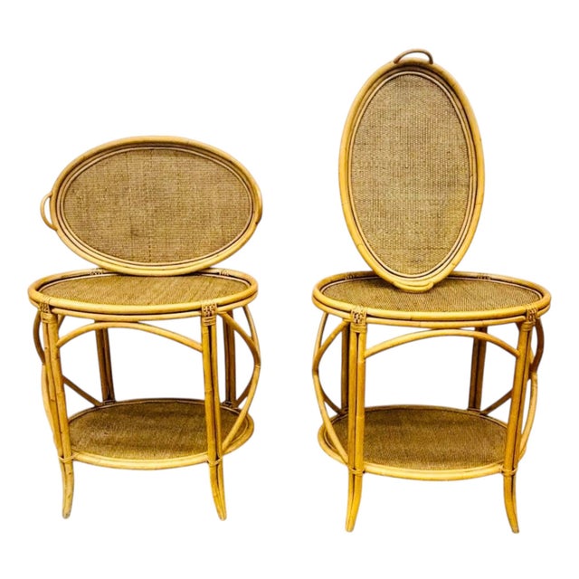 This is a pair of oval rattan side tables, dating to the 1970s. They are in the style of McGuire, with a thick hand-bent...