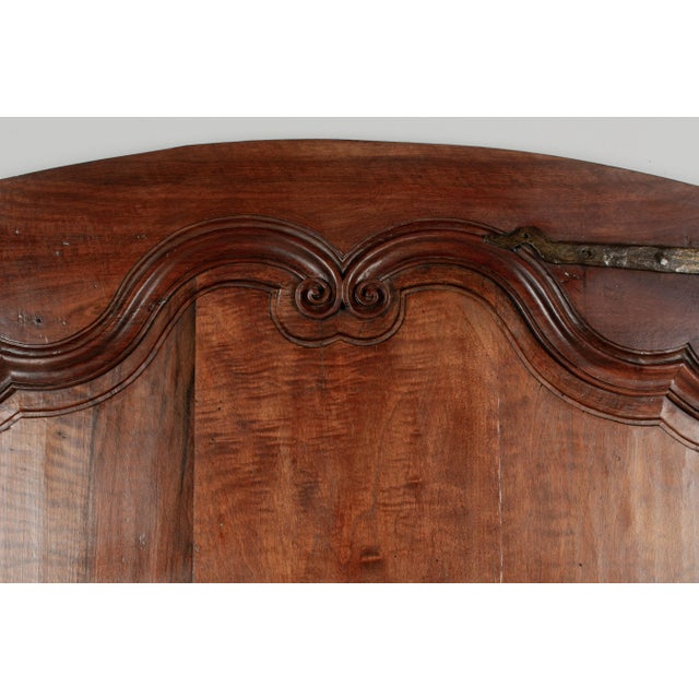 A 19th Century Louis XV style walnut door from the Loire Valley. This two sided interior door is made of thick planks of...