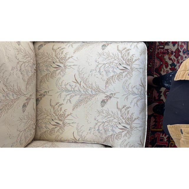 A beautifully tailored Drexel Heritage loveseat upholstered in a soft neutral botanical fabric that reads effortlessly...