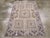 A vintage Turkish Anatolian throw rug. This pale straw ground scatter has a 2/1/2 pattern of hooked, nested square...
