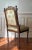 A 19th C. Walnut Louis XVI Style Chaise a La Reine. With musical and ribbon cravings and original silk Upholstry. Some...