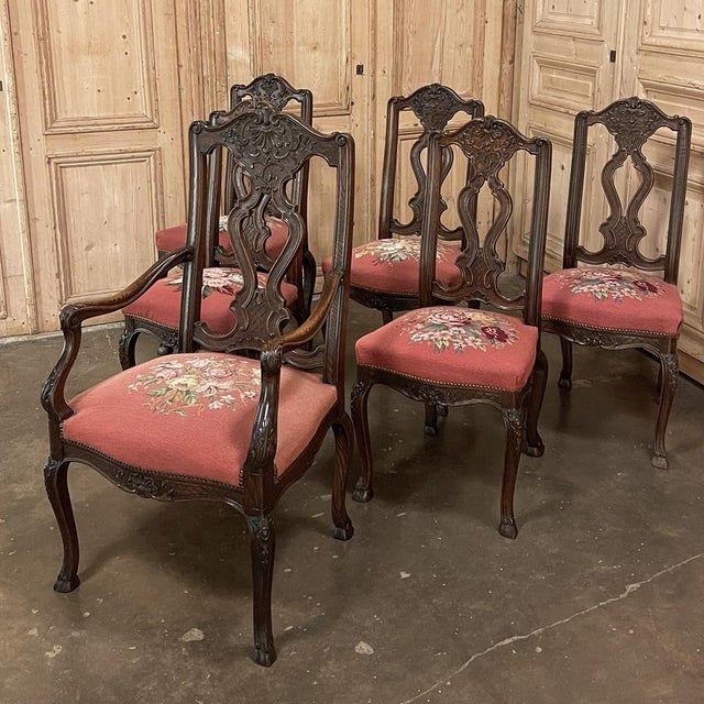 A set of six antique Liegeoise dining chairs, including one armchair, hand carved in solid oak and upholstered in hand...