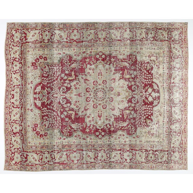 This exquisite antique Heriz rug showcases the bold, iconic artistry that has made Heriz carpets some of the most sought-...