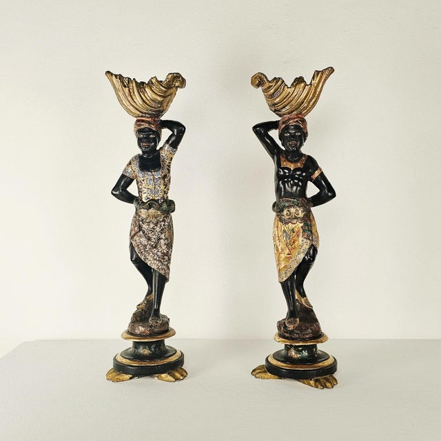 A handsome pair of Venetian figurines, each depicted in traditional dress and holding a tray - a classic expression of the...
