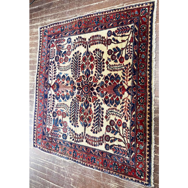 This beautiful antique Persian Mohajeran Sarouk is an especially desirable example due to its unusual nearly square format...