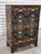 Vintage Asian lacquered cabinet, with handpainted polychrome motif of flowering lotus and scrolling vines throughout its...
