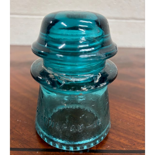 This is a gorgeous aqua or teal vintage glass Hemingray insulator. “Hemingray-16.” Made in the U.S.A. Has some chips, as...