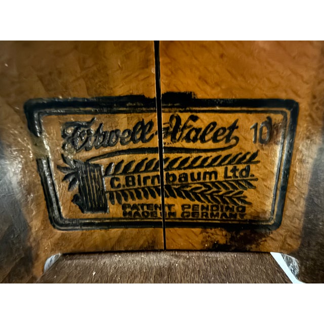 This is a C. Birnbaum Valet from the mid-20th Century. It has been sanded and stained with an espresso stain.