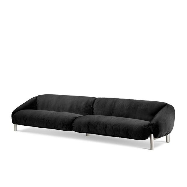 An elegant tribute to Brazilian mid-century design, this sofa is an exercise in plump volumes promising moments of...