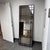 Design Plus Gallery presents the Atticus Mirror from Uttermost. This tall rectangular mirror is framed in bronze-toned...