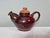 This handcrafted set from the workshop of Helma Klett (1908-1996) consists of a bulbous teapot and two matching cups, each...