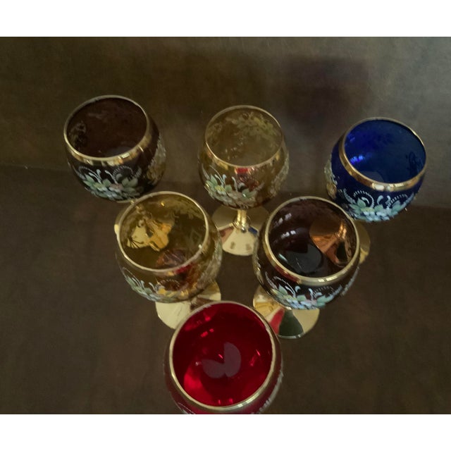 Extravagantly decorated with bright 24K gold (indicated on the bottom of each glass) and glass appliqués; these wine...