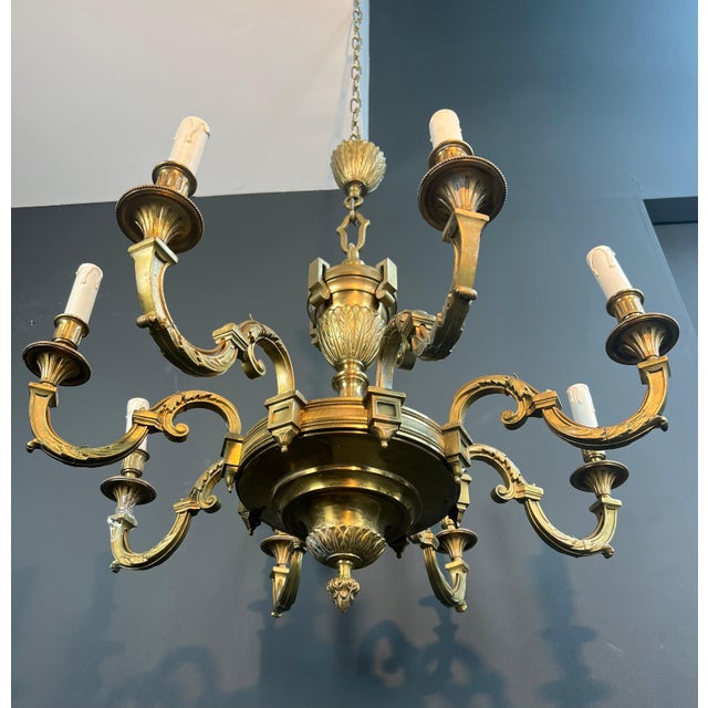 This beautiful 8-arm chandelier is made of finely chiseled bronze. It is a French work in the Louis XVI style by Lucien...