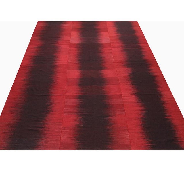 ACTUAL SIZE: 10’9″ x 13’4″ PRIMARY COLOR: Red / Black AGE: New ORIGIN: Iran MATERIALS: Wool FOUNDATION: Cotton PRODUCTION:...