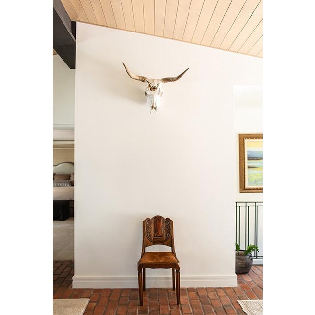 Some pieces simply furnish a room, others bring depth, memory, and presence. This antique chair, glows with a warm,...