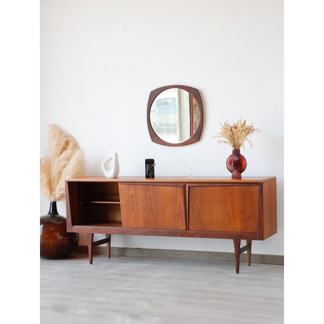 Add a touch of authentic elegance to your home with this magnificent 1960s teak sideboard. Crafted by the renowned British...