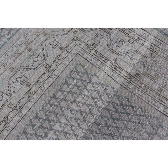 Distressed Persian Antique Tabriz Carpet With Muted Floral Design in Light Gray For Sale - Image 11 of 11