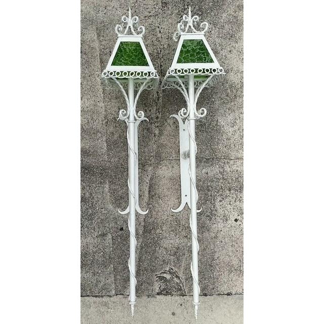 Elevate your exterior or interior space with this monumental pair of vintage light sconces, dating to the mid-1950s. These...