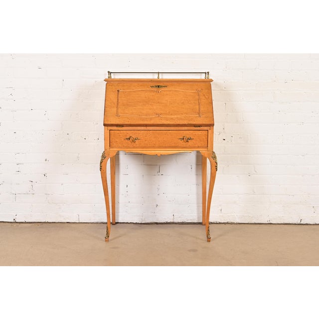 A gorgeous petite French Provincial Louis XV style drop front writing desk or secretary desk In the manner of Baker...